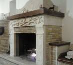 Fireplace of Lemons:cladding in listel Etrusca stone and beam in travertine.